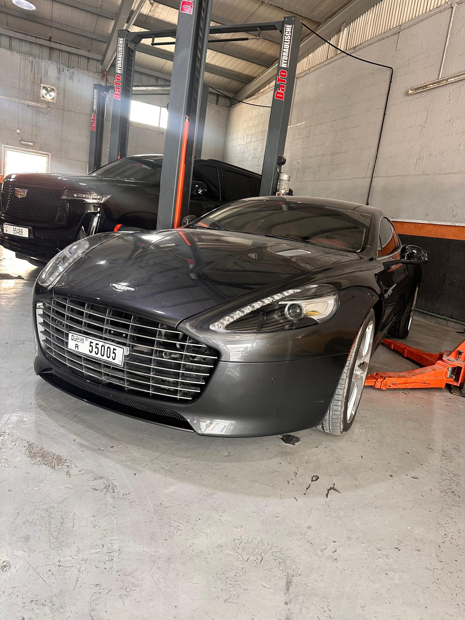 Aston Martin and Cadillac at Car Workshop Dubai